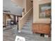 Entryway view of staircase, wood style tile floors, and modern fireplace feature at 223 Positive Point St, Henderson, NV 89012