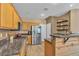 Bright kitchen with stainless steel appliances, breakfast bar, and modern finishes at 223 Positive Point St, Henderson, NV 89012
