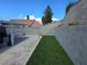 An expansive backyard featuring artificial turf, a block wall and easy access from side yard at 2370 Ray Kanel Dr, Las Vegas, NV 89156