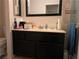 Bathroom with single sink vanity and well-lit mirror at 2370 Ray Kanel Dr, Las Vegas, NV 89156