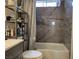 Bathroom with a tub featuring contemporary grey tile at 2370 Ray Kanel Dr, Las Vegas, NV 89156