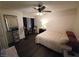Well-lit bedroom features a ceiling fan and hardwood floors at 2370 Ray Kanel Dr, Las Vegas, NV 89156
