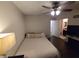 Comfortable bedroom features ceiling fan and wood-look flooring at 2370 Ray Kanel Dr, Las Vegas, NV 89156