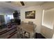 The dining area features a modern table and chairs with natural light, adjacent to the living room at 2370 Ray Kanel Dr, Las Vegas, NV 89156
