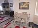 Cozy dining area adjacent to the living room with tile flooring at 2370 Ray Kanel Dr, Las Vegas, NV 89156