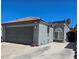 The property features a large driveway and well-maintained exterior at 2370 Ray Kanel Dr, Las Vegas, NV 89156