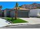Charming single-story home with mature landscaping, a two-car garage, and a mountain backdrop at 2370 Ray Kanel Dr, Las Vegas, NV 89156