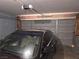 Garage interior featuring a modern vehicle inside the home's parking space for convenience and security at 2370 Ray Kanel Dr, Las Vegas, NV 89156