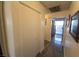 Hallway features a closet and tiled floors, leading to a bright entryway with natural light at 2370 Ray Kanel Dr, Las Vegas, NV 89156