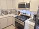 Well-equipped kitchen with stainless steel appliances, stylish countertops, and modern cabinetry at 2370 Ray Kanel Dr, Las Vegas, NV 89156