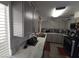 The kitchen features gray cabinets, modern appliances, and granite countertops, offering both style and functionality at 2370 Ray Kanel Dr, Las Vegas, NV 89156