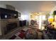 Inviting living area features a fireplace and flows into the dining area at 2370 Ray Kanel Dr, Las Vegas, NV 89156