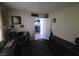 Office space with an open doorway, desk, and dark wood-look floors at 2370 Ray Kanel Dr, Las Vegas, NV 89156