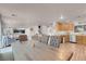 Charming dining area with a rustic table, tufted chairs, and open access to the kitchen and living spaces at 2504 Courlan Dr, North Las Vegas, NV 89084