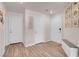Spacious foyer with hardwood floors, a storage bench, and a gallery wall offering a grand entrance at 2504 Courlan Dr, North Las Vegas, NV 89084