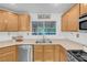 Updated kitchen featuring stainless steel appliances, a window above the sink, and plenty of cabinet space at 2504 Courlan Dr, North Las Vegas, NV 89084