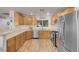 Spacious kitchen with stainless steel appliances, wood flooring, and ample cabinet space at 2504 Courlan Dr, North Las Vegas, NV 89084