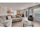 Open-concept living room flows into the dining area and kitchen, perfect for entertaining guests and Gathering at 2504 Courlan Dr, North Las Vegas, NV 89084