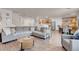 Open-concept living room flows into the dining area and kitchen, perfect for entertaining guests and Gathering at 2504 Courlan Dr, North Las Vegas, NV 89084