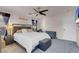Inviting main bedroom with a ceiling fan, seating area, and soft carpeting at 2504 Courlan Dr, North Las Vegas, NV 89084