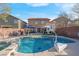 Backyard featuring a sparkling pool and spa, perfect for relaxation and outdoor entertaining at 2504 Courlan Dr, North Las Vegas, NV 89084