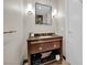 Well-lit bathroom with modern vanity, mirror, and sconce lighting at 2700 Las Vegas Blvd # 1803, Las Vegas, NV 89109