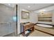 Bathroom features an enclosed glass shower, soaking tub and vanity at 2700 Las Vegas Blvd # 1803, Las Vegas, NV 89109