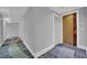 Condo hallway entrance showing unit number 1803 with patterned carpet and painted gray walls at 2700 Las Vegas Blvd # 1803, Las Vegas, NV 89109