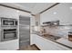Modern kitchen with stainless steel appliances, white cabinetry, and sleek countertops at 2700 Las Vegas Blvd # 1803, Las Vegas, NV 89109