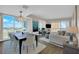 Bright living room featuring hardwood floors, a chandelier, modern furniture, and floor-to-ceiling windows with city views at 2700 Las Vegas Blvd # 1803, Las Vegas, NV 89109