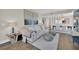 An open floor plan features a living room with hardwood floors, a dining area, and a comfortable sofa at 2700 Las Vegas Blvd # 1803, Las Vegas, NV 89109