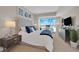 This spacious bedroom includes a bed, nightstands, city views, and a TV for a stylish and comfortable living space at 2700 Las Vegas Blvd # 1803, Las Vegas, NV 89109