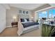 Modern bedroom features a gray headboard bed, city views, and a desk for a comfortable and stylish living space at 2700 Las Vegas Blvd # 1803, Las Vegas, NV 89109