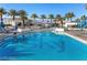 Refreshing pool with lounge chairs, blue umbrellas, and palm trees, perfect for relaxation and enjoyment at 2700 Las Vegas Blvd # 1803, Las Vegas, NV 89109