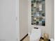 Elegant powder room with modern commode and decorative wall art at 2700 Las Vegas Blvd # 1803, Las Vegas, NV 89109