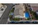Aerial view of a home with a sparkling blue pool and lush green landscaping at 3043 Jacaranda Dr, Las Vegas, NV 89117
