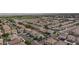 An aerial view showcasing a well-planned community with neatly arranged homes and green spaces, some including private pools at 3043 Jacaranda Dr, Las Vegas, NV 89117