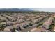 An aerial view of a residential neighborhood in a suburban area with mountain views in the distance at 3043 Jacaranda Dr, Las Vegas, NV 89117