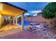 Inviting backyard featuring a refreshing swimming pool and comfortable lounge chairs at 3043 Jacaranda Dr, Las Vegas, NV 89117