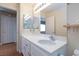 Bathroom with a vanity and dual mirrors that give it a touch of modern style at 3043 Jacaranda Dr, Las Vegas, NV 89117