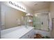 Bright bathroom featuring a vanity, large mirror, and shower with sliding glass doors at 3043 Jacaranda Dr, Las Vegas, NV 89117
