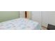 The simple bedroom features sea-themed decor, a comfortable bed, and tile flooring at 3043 Jacaranda Dr, Las Vegas, NV 89117