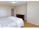Neutral bedroom with hardwood floors and an inviting, patterned bedspread at 3043 Jacaranda Dr, Las Vegas, NV 89117