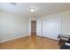 A bright and neutral bedroom featuring hardwood floors and a large closet at 3043 Jacaranda Dr, Las Vegas, NV 89117