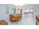 Bright dining area adjacent to the kitchen with a large wooden table and chandelier lighting at 3043 Jacaranda Dr, Las Vegas, NV 89117
