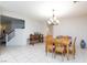 Bright dining room features tile floors, wood table set, and decorative light fixture at 3043 Jacaranda Dr, Las Vegas, NV 89117