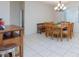 Spacious dining room showcases a wooden table and chairs with large window at 3043 Jacaranda Dr, Las Vegas, NV 89117