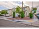 Charming two-story home with landscaped front yard in a suburban neighborhood, featuring a two-car garage at 3043 Jacaranda Dr, Las Vegas, NV 89117