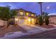 Well-maintained two-story house with a spacious driveway and neatly trimmed bushes at 3043 Jacaranda Dr, Las Vegas, NV 89117