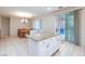 Bright kitchen with island, seamlessly connecting to the dining area and offering views of the inviting outdoor pool at 3043 Jacaranda Dr, Las Vegas, NV 89117